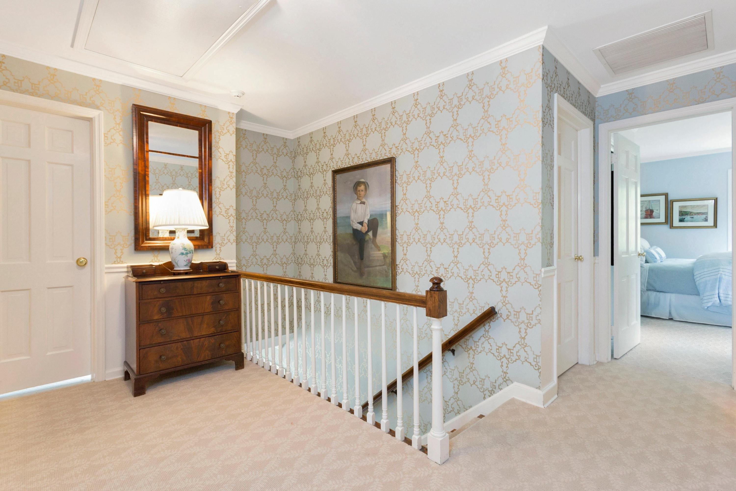 350 Middlesex Road Darien, CT 06820 - Photo 15 of 23 a view of a hallway to a bedroom with furniture