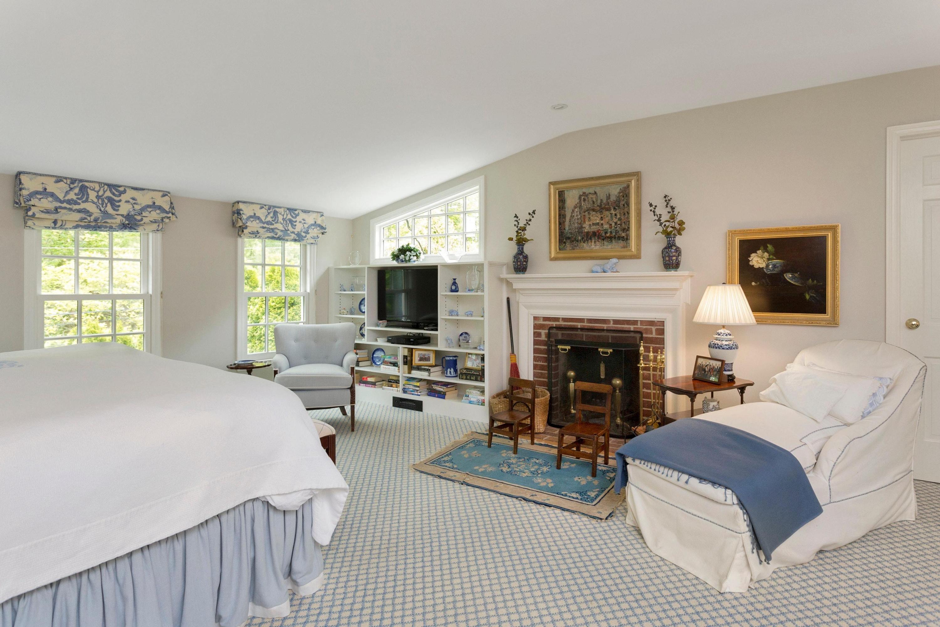350 Middlesex Road Darien, CT 06820 - Photo 17 of 23 a living room with furniture a flat screen tv and a fireplace