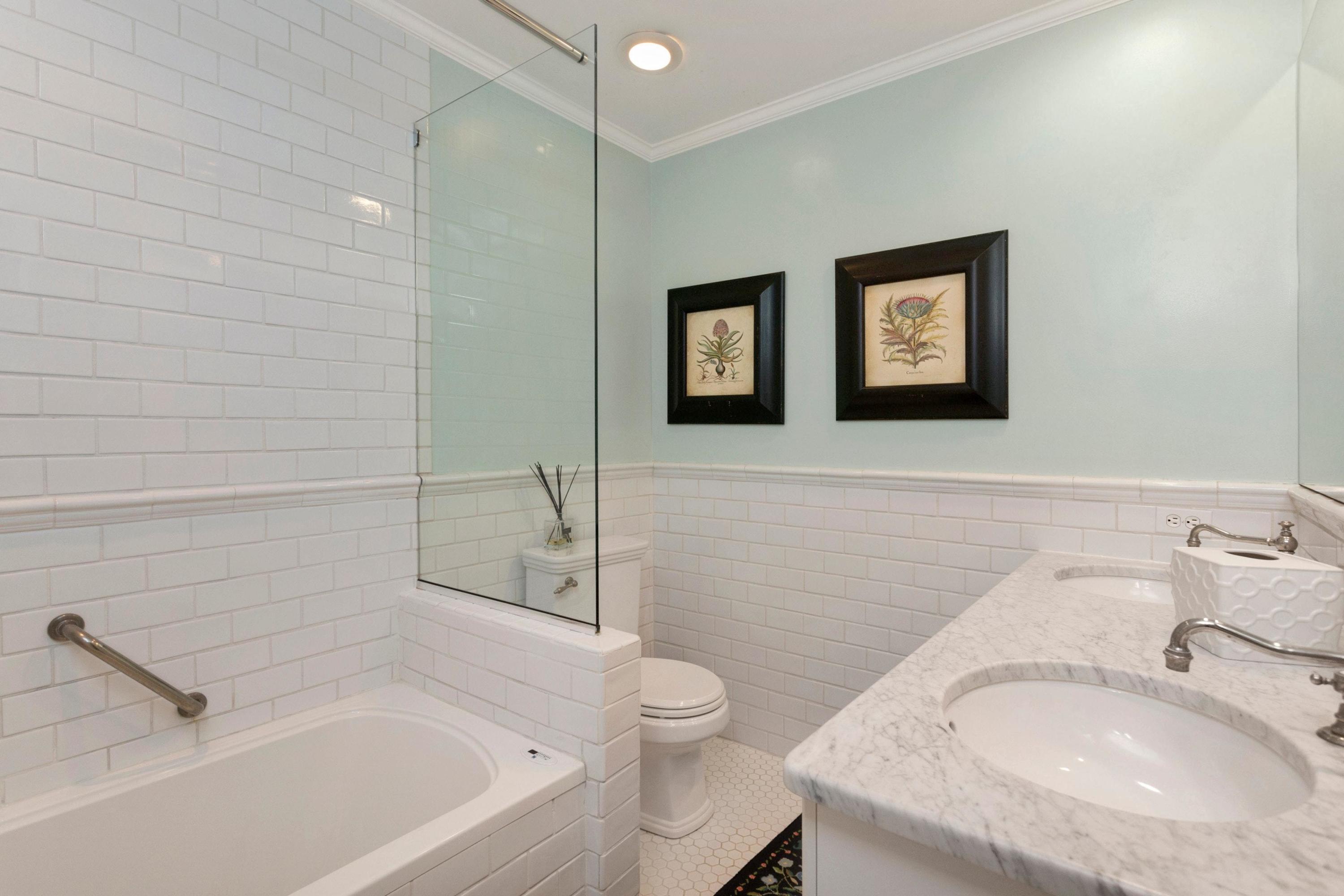 350 Middlesex Road Darien, CT 06820 - Photo 20 of 23 a bathroom with a granite countertop sink a toilet and shower