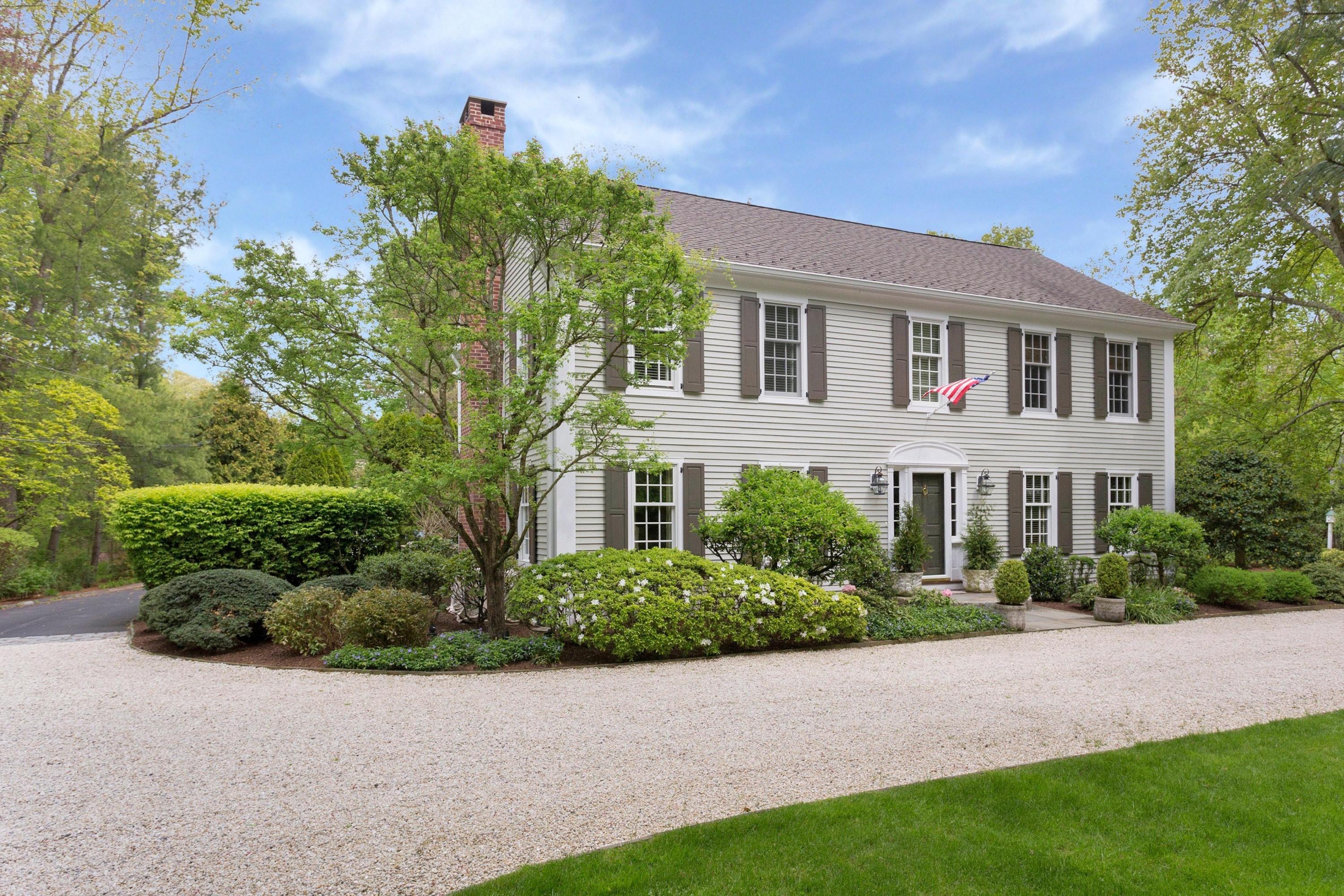 350 Middlesex Road Darien, CT 06820 - Photo 2 of 23 a front view of a house with a garden