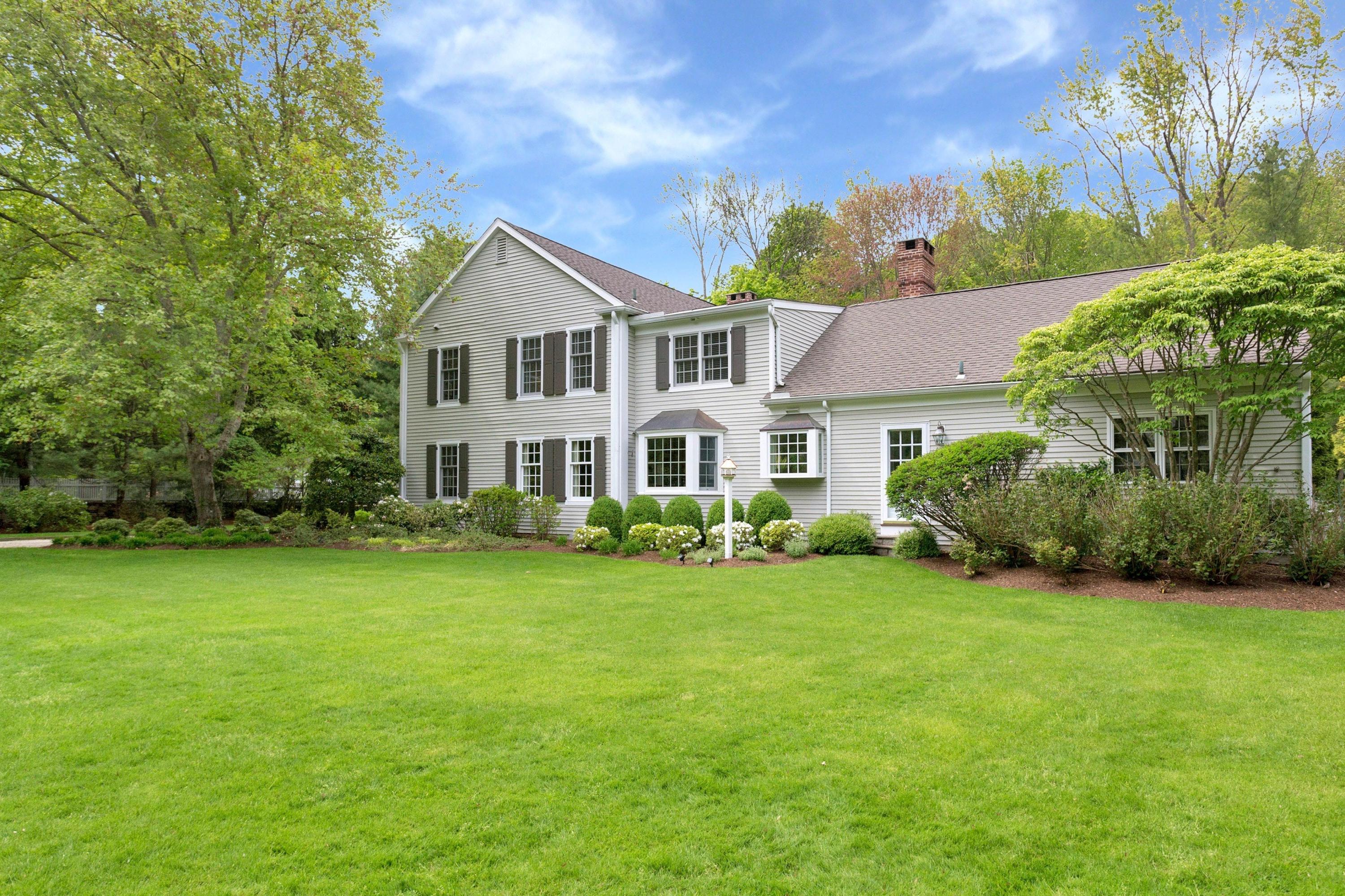 350 Middlesex Road Darien, CT 06820 - Photo 22 of 23 a front view of a house with garden