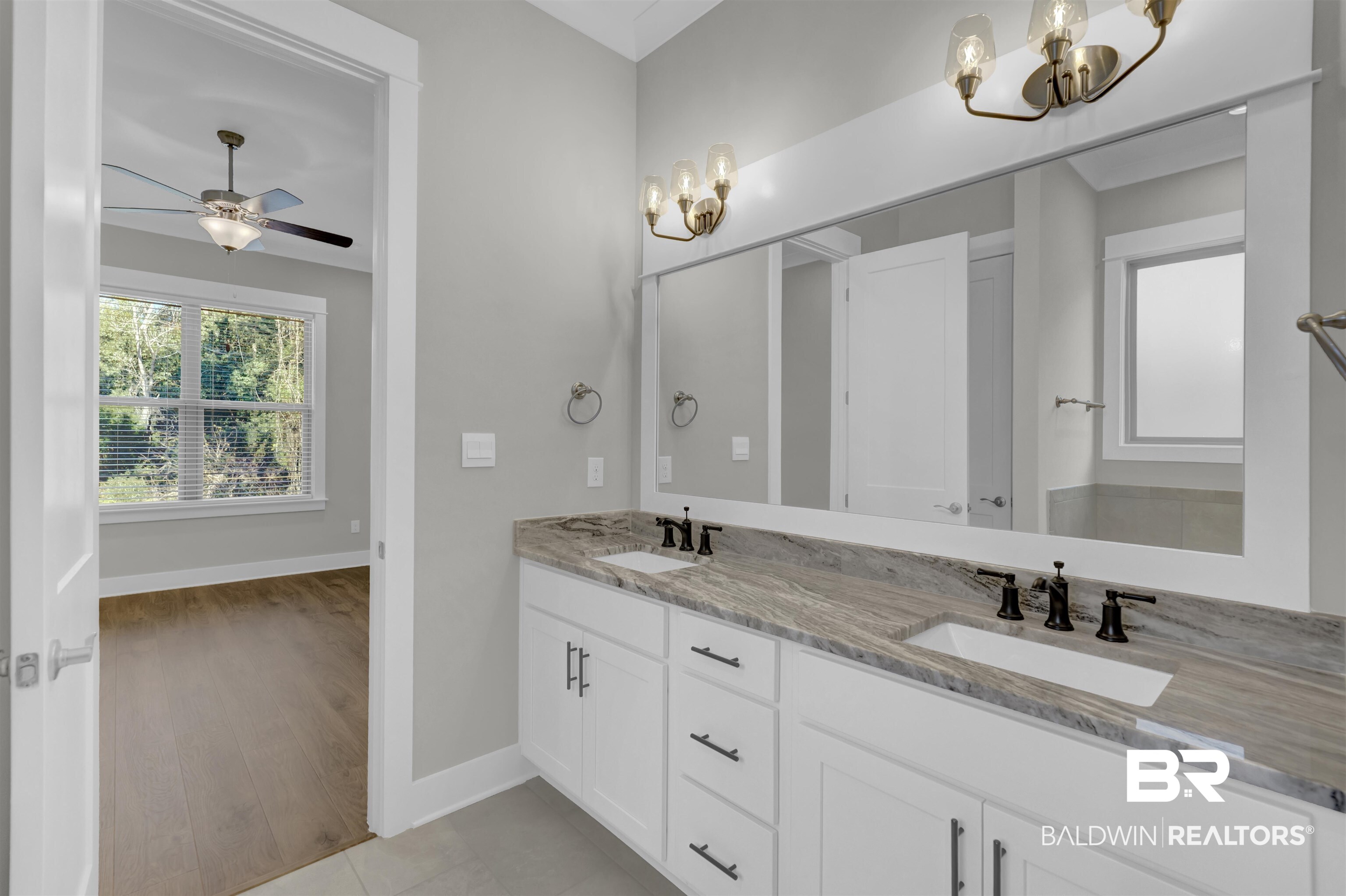 571 Morning Mist Way Fairhope, AL 36532 - Photo 23 of 47 Bathroom with a chandelier, double vanity, and a ceiling fan
