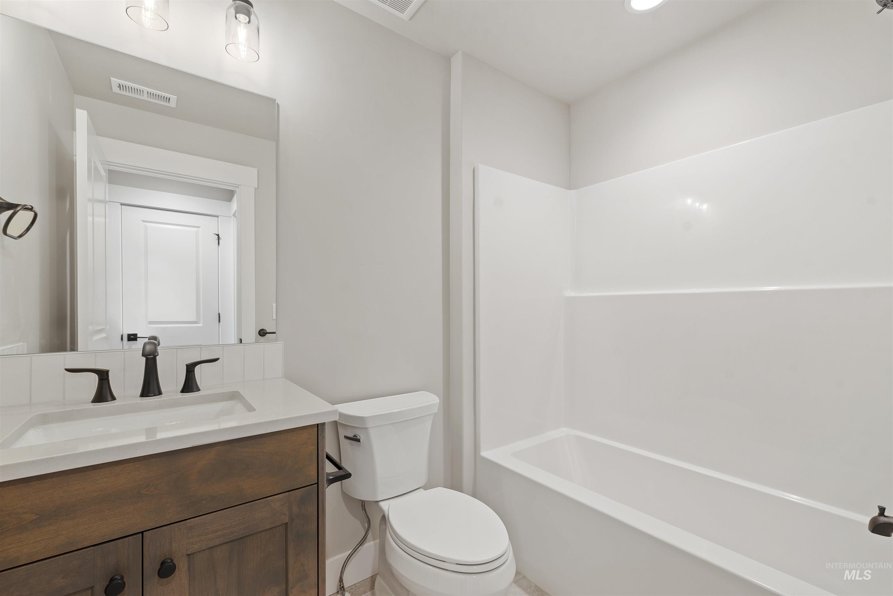 7616 Brown Way Eagle, ID 83714 - Photo 3 of 21 Full bathroom with vanity and shower / tub combination