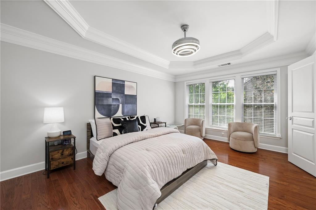 2872 Overlook Way Northeast Atlanta, GA 30324 - Photo 16 of 47 a bedroom with a bed and wooden floor