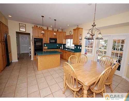 85 Dellwood Road Edison, NJ 08820 - Photo 8 of 8 a dining room with furniture a window and kitchen view