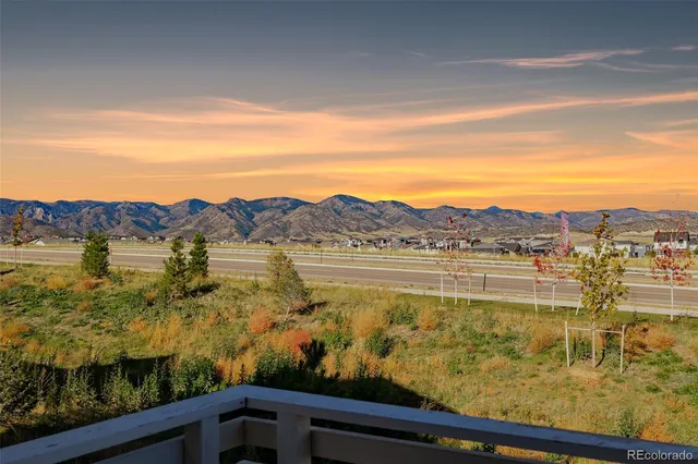 a livingroom with workspace and a window