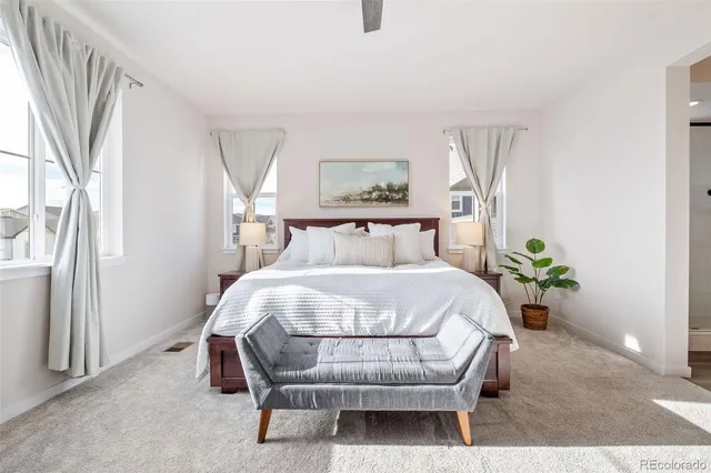a bathroom with a double vanity sink and mirror with shower