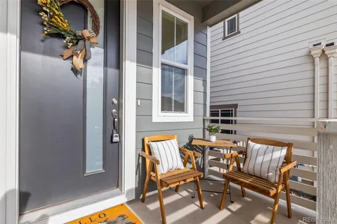 a patio with table and chairs