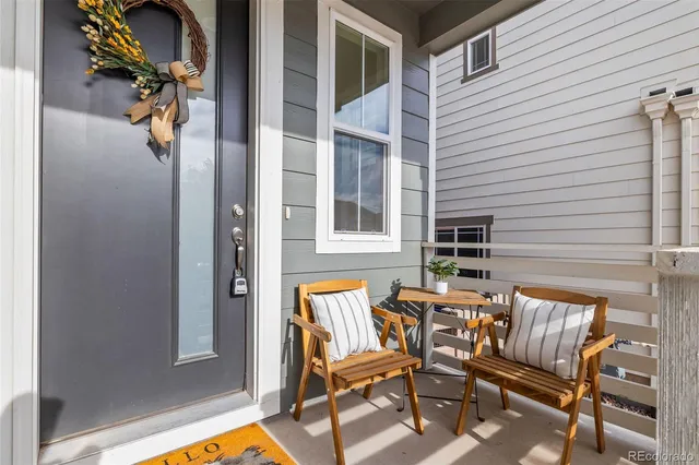 a living room with fireplace furniture and a flat screen tv