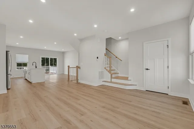 a kitchen with stainless steel appliances granite countertop a sink and cabinets
