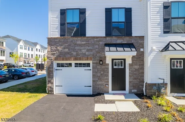 an aerial view of residential houses with yard and swimming pool
