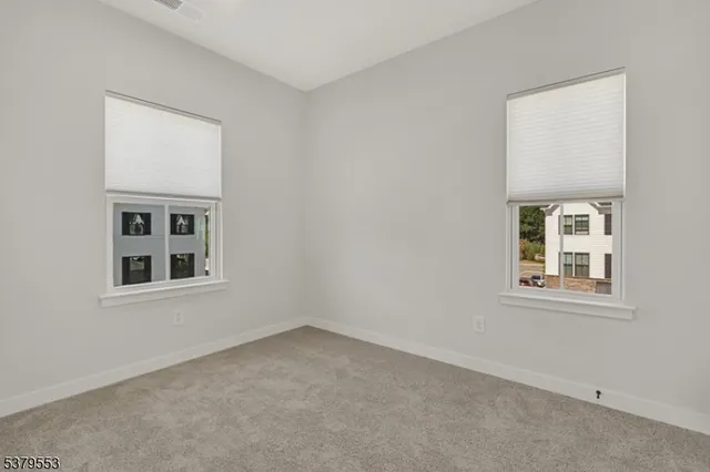 a room with a sink and mirror