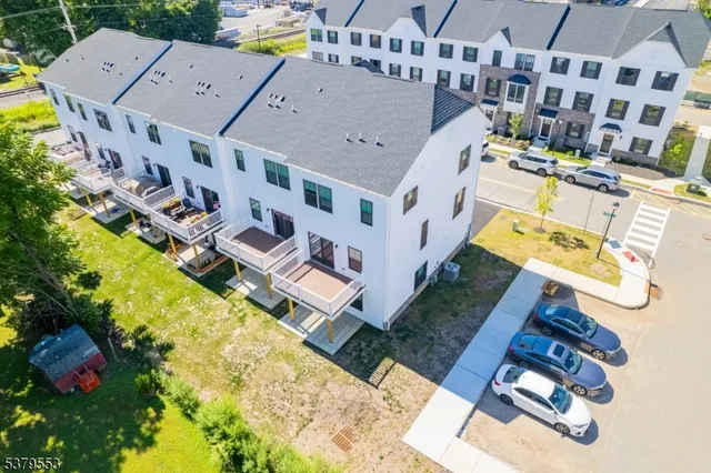 a view of a house with wooden deck