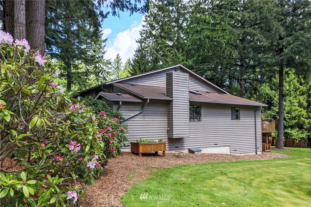 17213 Gravenstein Road Bothell, WA 98012 - Photo 3 of 14 a backyard of a house with seating space