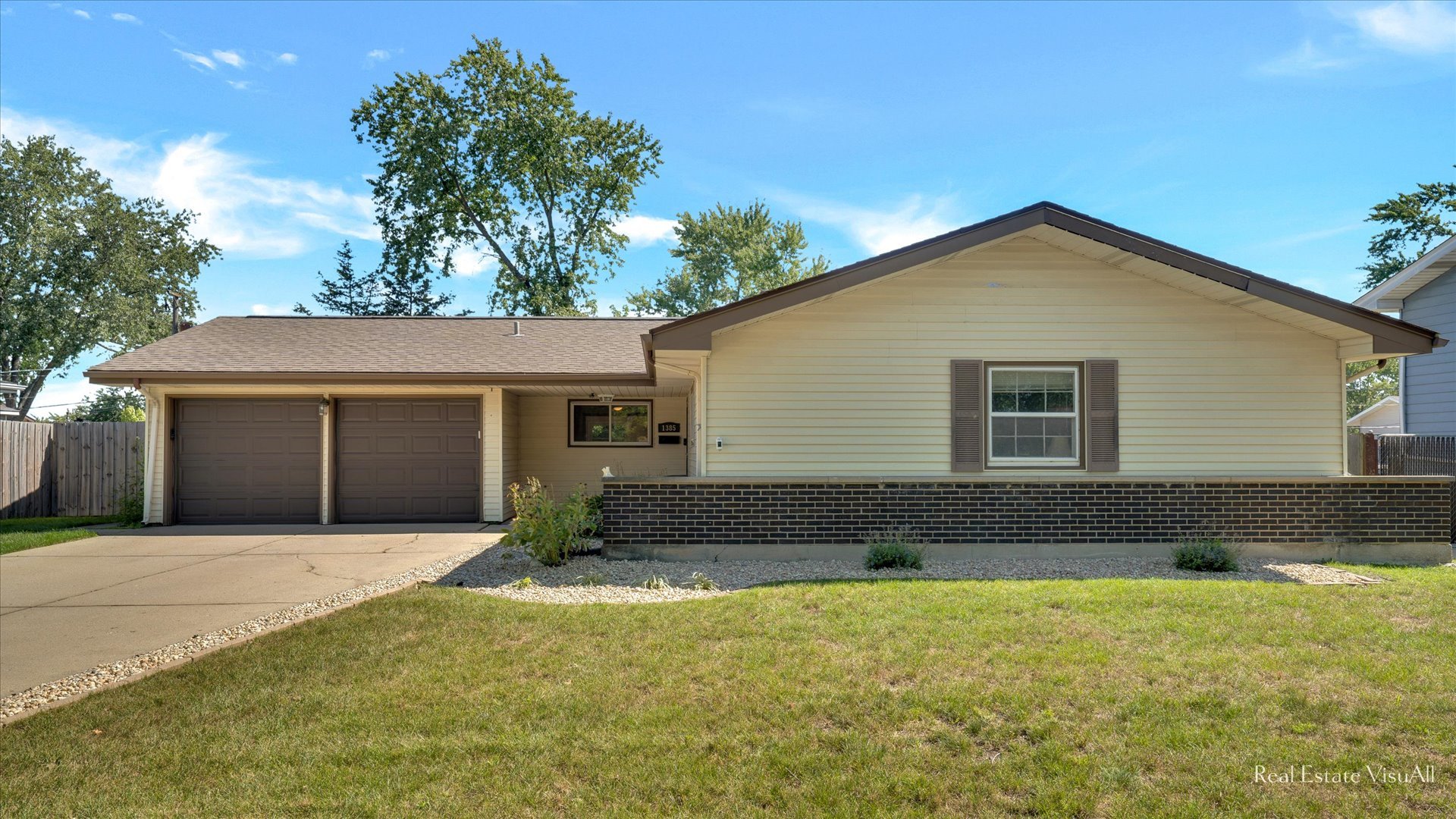 1385 Cooper Road Hoffman Estates, IL 60169 - Photo 1 of 26 a front view of a house with a yard