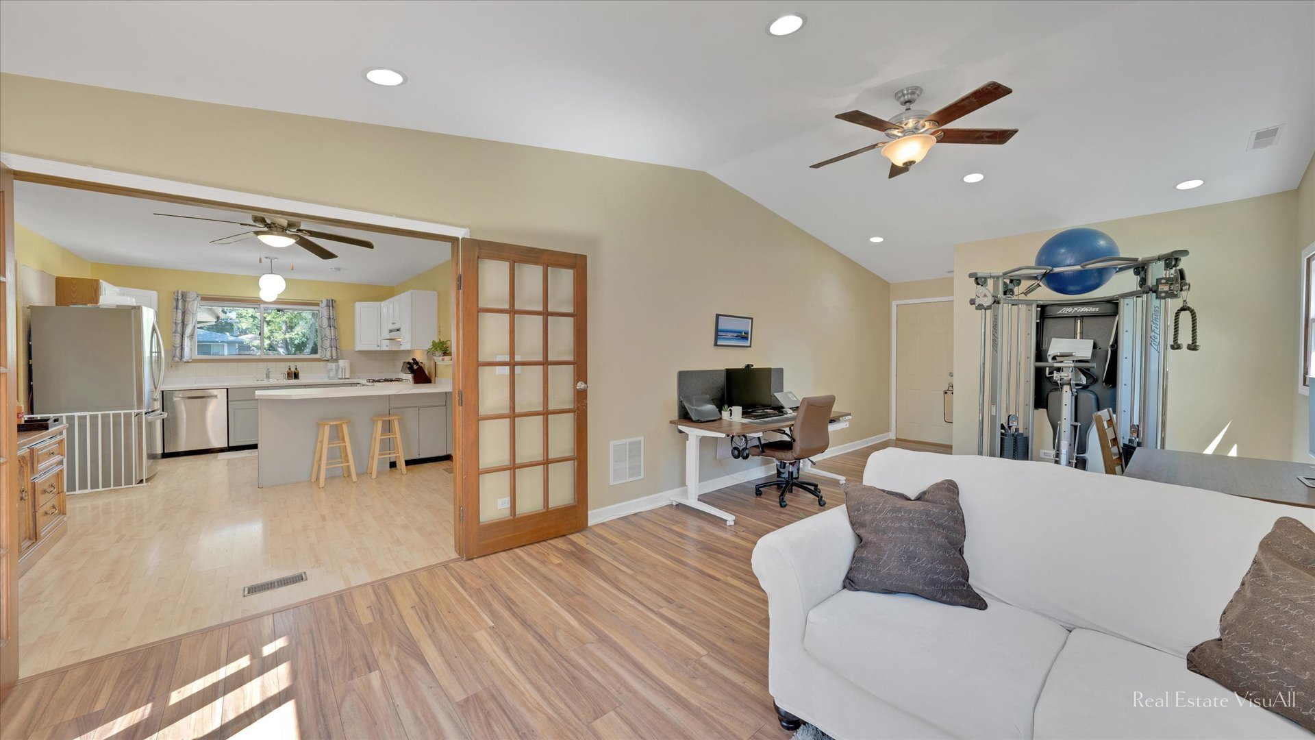 1385 Cooper Road Hoffman Estates, IL 60169 - Photo 12 of 26 a living room with furniture and kitchen view