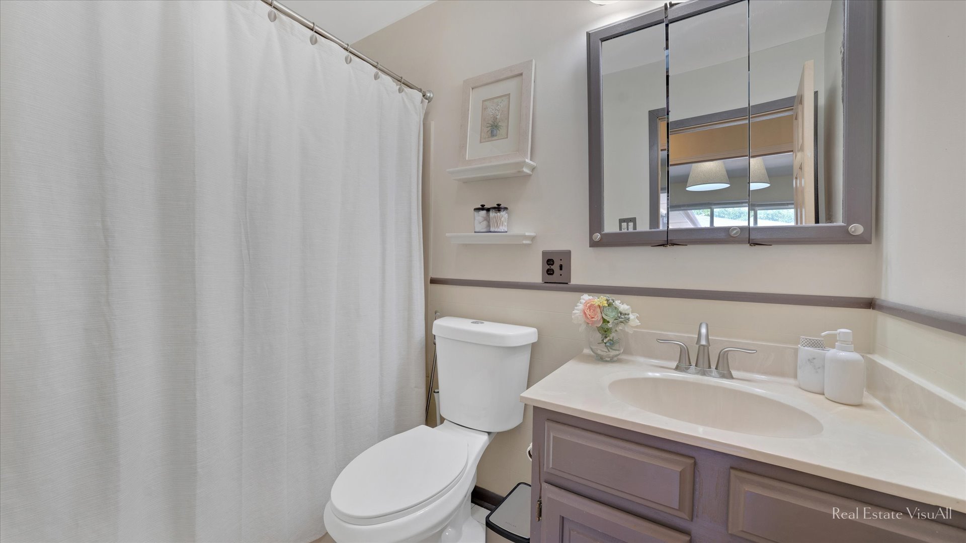 1385 Cooper Road Hoffman Estates, IL 60169 - Photo 21 of 26 a bathroom with a sink a toilet and a mirror