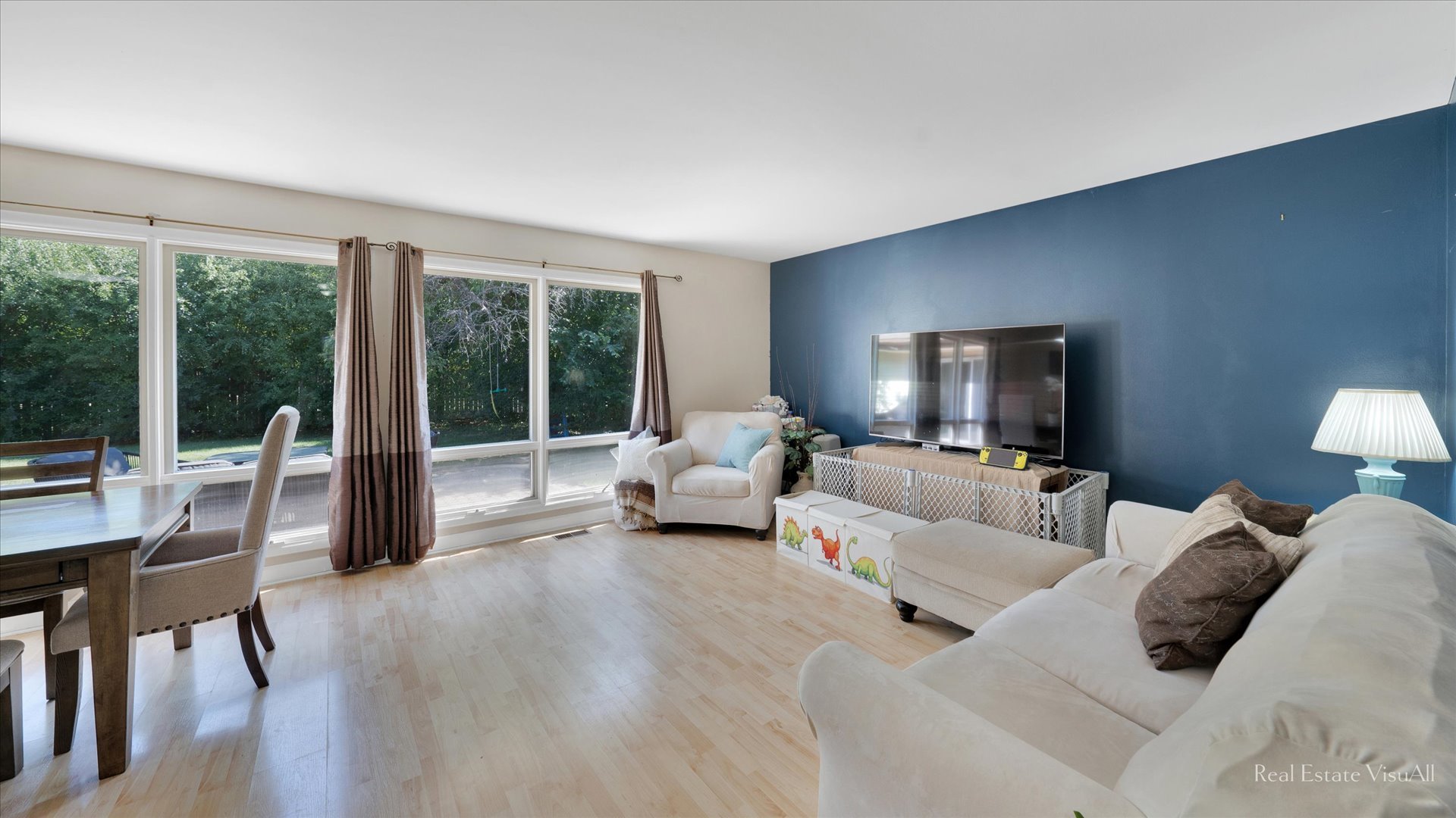 1385 Cooper Road Hoffman Estates, IL 60169 - Photo 4 of 26 a living room with furniture and a large window