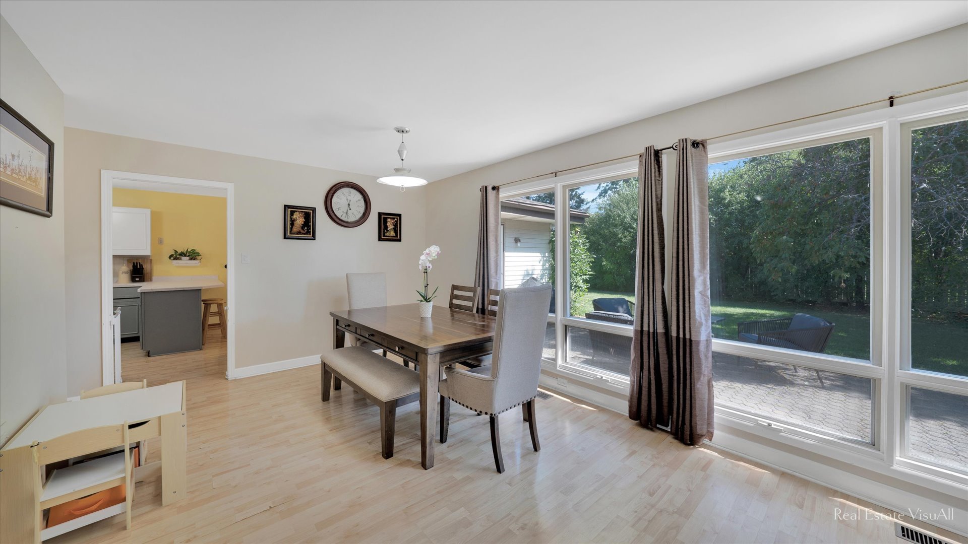 1385 Cooper Road Hoffman Estates, IL 60169 - Photo 6 of 26 a view of a dining room with furniture window and wooden floor