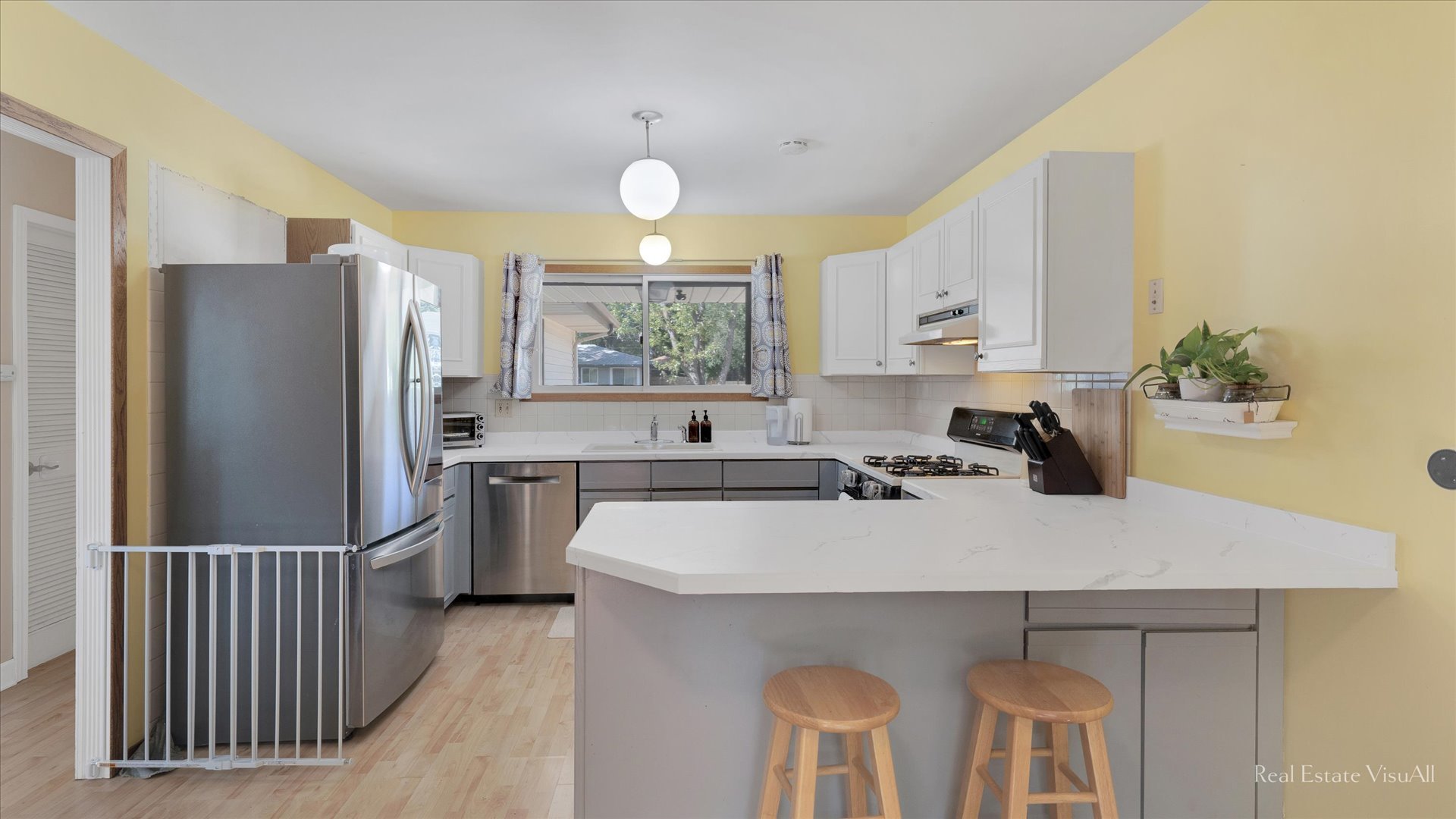 1385 Cooper Road Hoffman Estates, IL 60169 - Photo 7 of 26 a kitchen with stainless steel appliances a sink cabinets and wooden floor