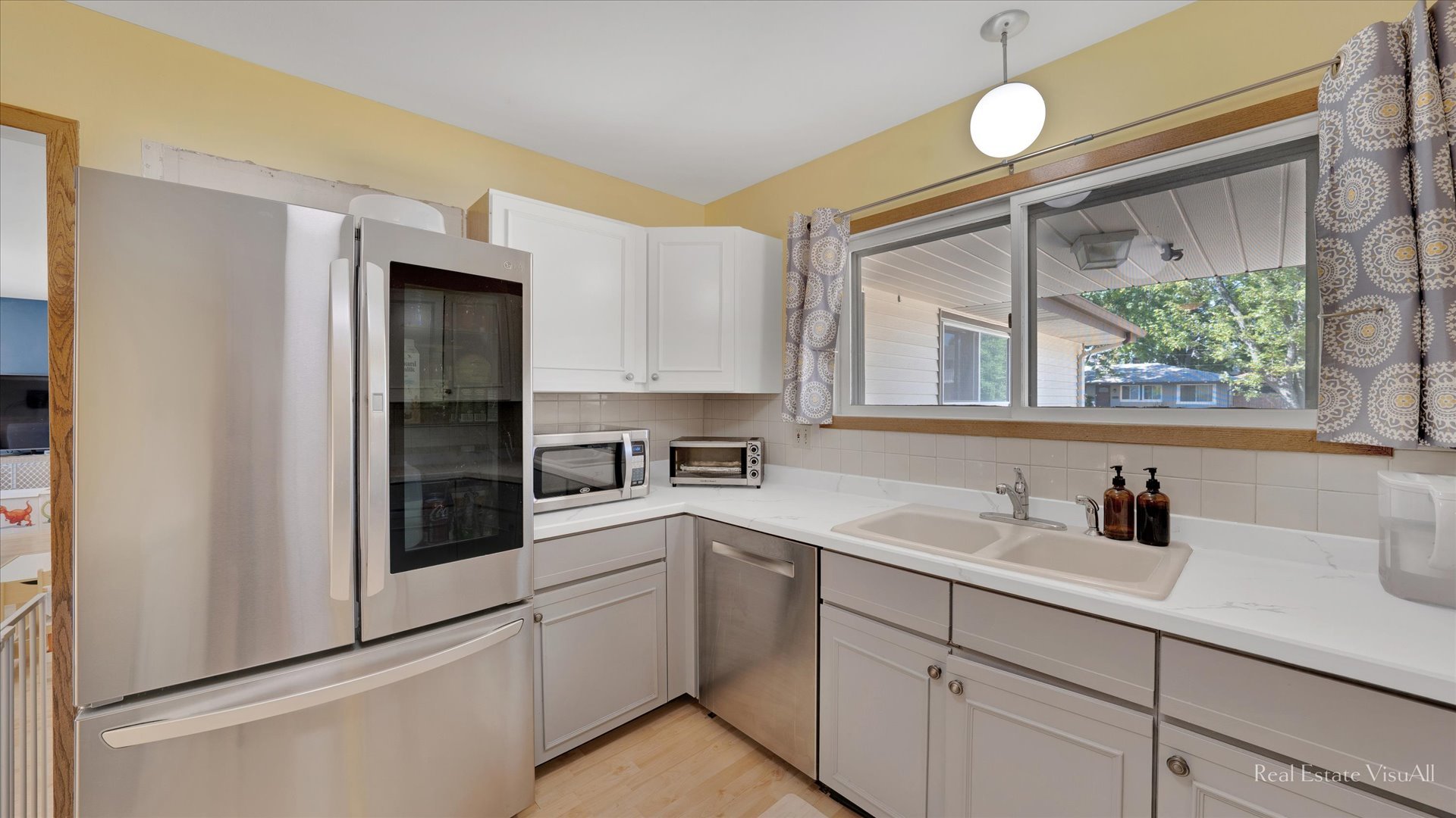 1385 Cooper Road Hoffman Estates, IL 60169 - Photo 8 of 26 a kitchen with a sink and cabinets