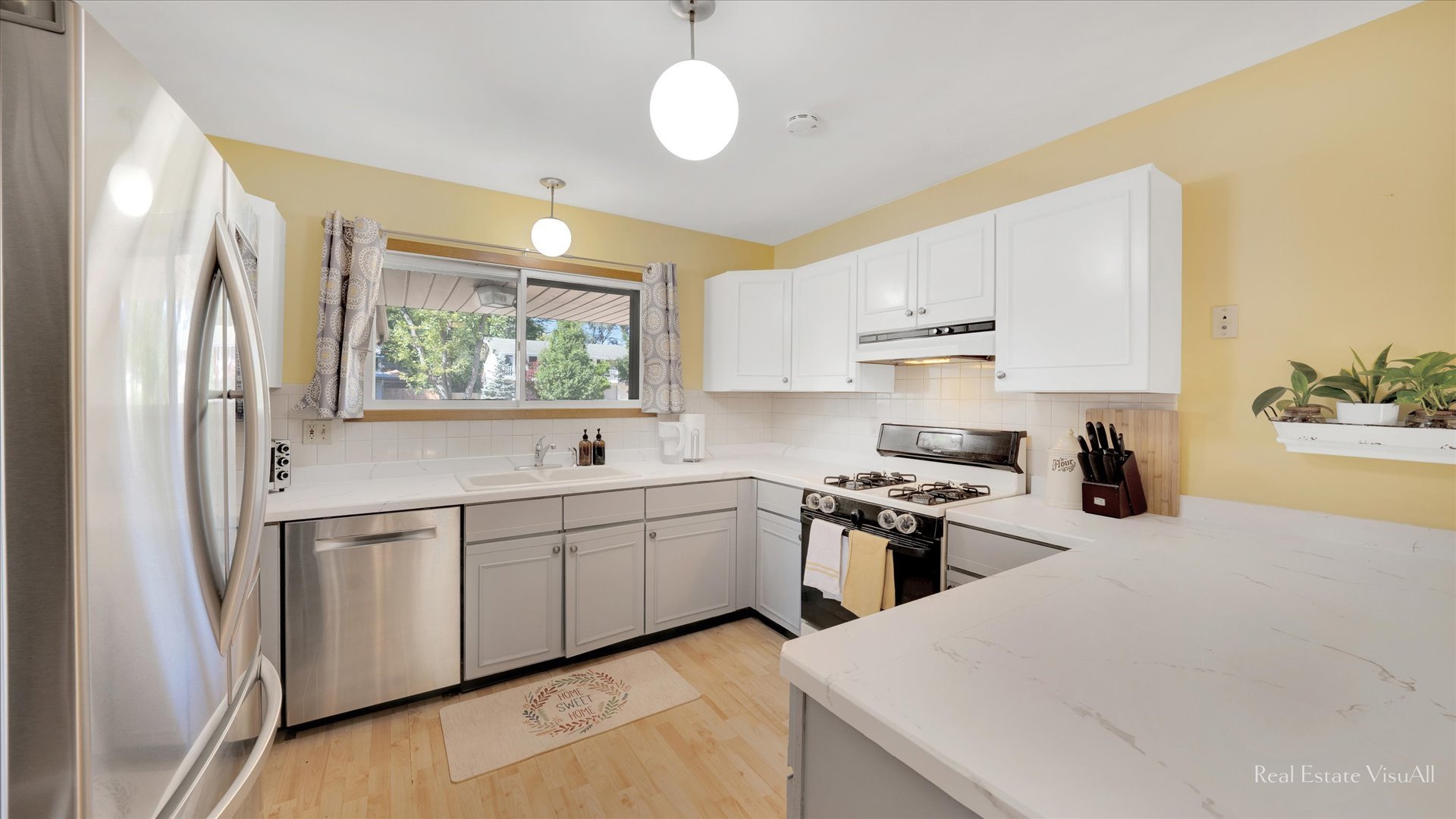 1385 Cooper Road Hoffman Estates, IL 60169 - Photo 9 of 26 a kitchen with stainless steel appliances granite countertop a sink stove and refrigerator