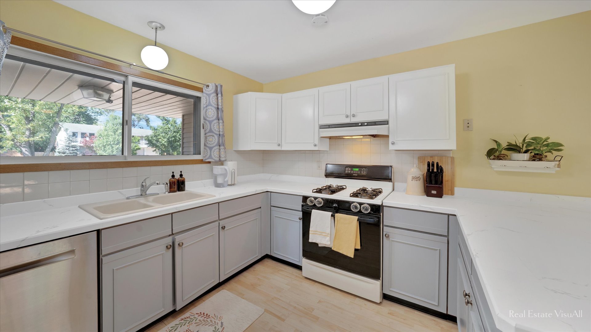 1385 Cooper Road Hoffman Estates, IL 60169 - Photo 10 of 26 a kitchen with a sink stove and cabinets