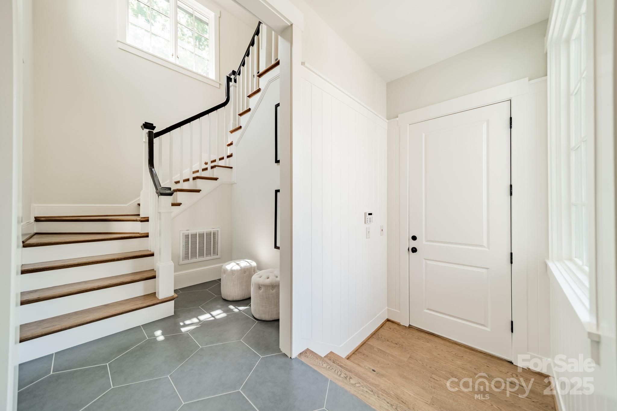 431 Bramble Way Fort Mill, SC 29708 - Photo 24 of 48 a view of a hallway with bathroom and wooden floor