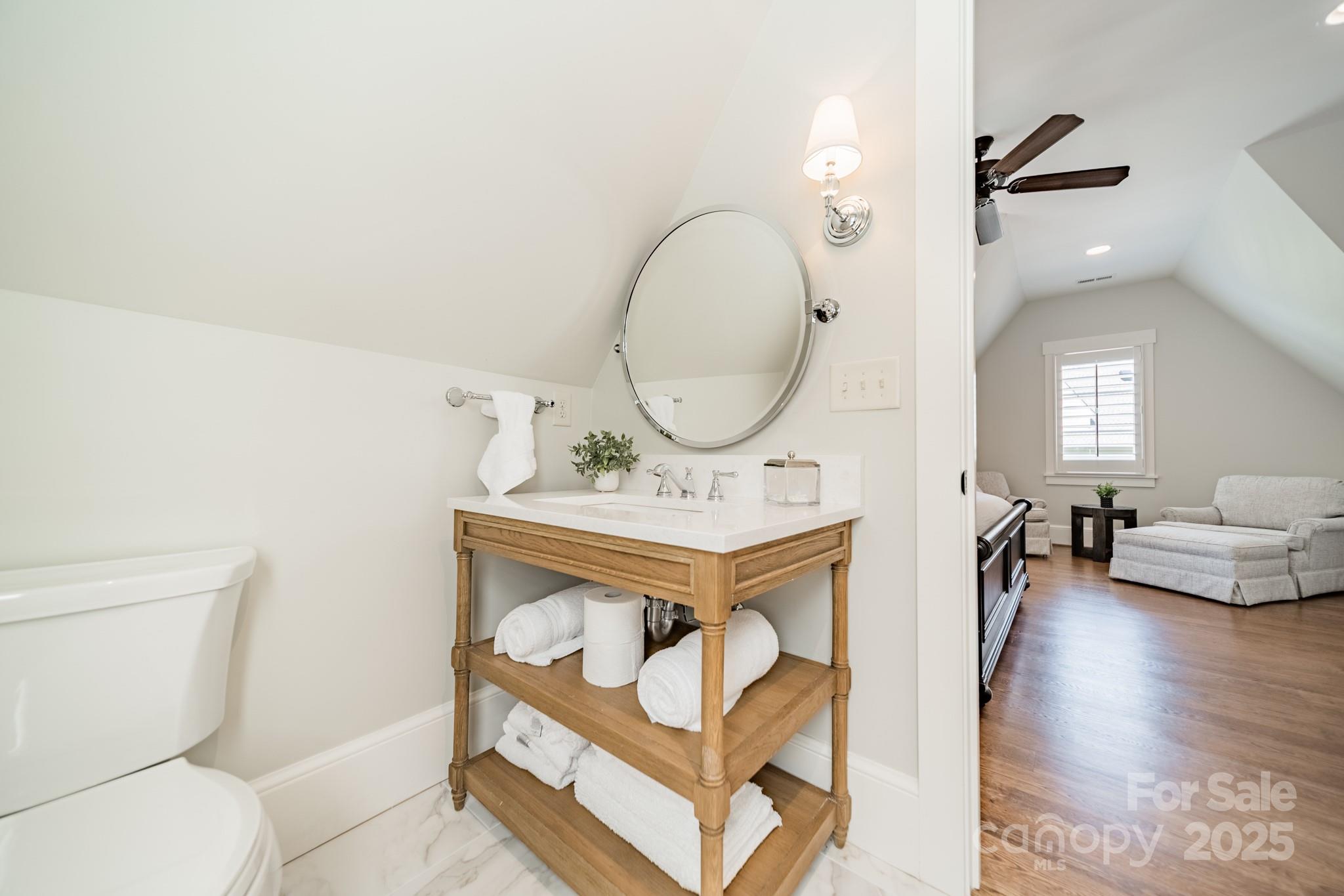 431 Bramble Way Fort Mill, SC 29708 - Photo 27 of 48 a living room with furniture a mirror and a toilet