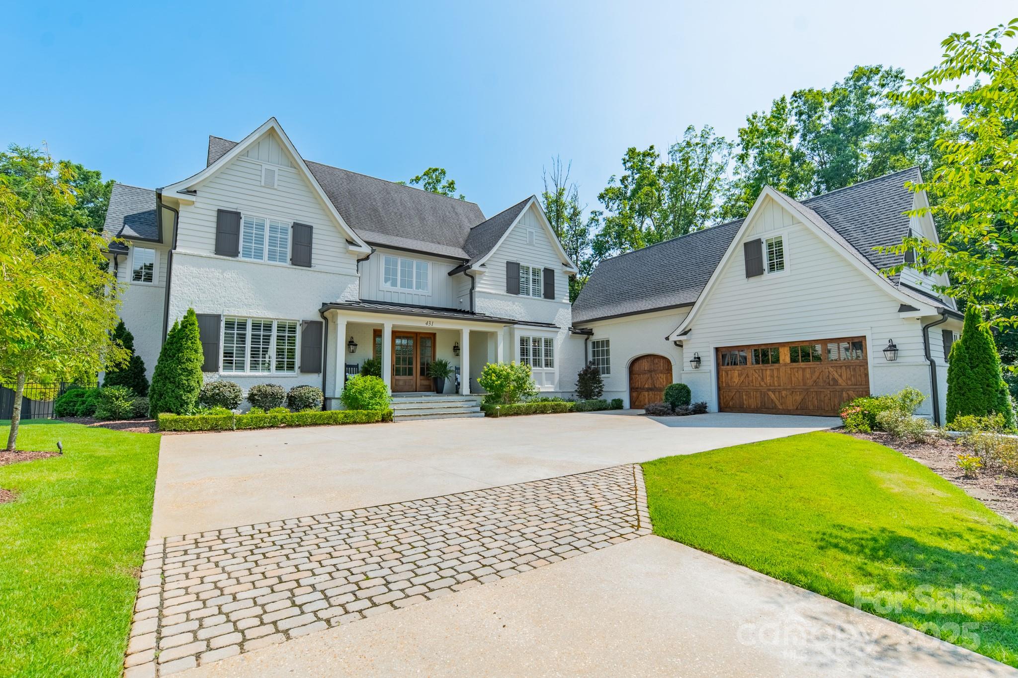 431 Bramble Way Fort Mill, SC 29708 - Photo 3 of 48 a front view of a house with a garden and yard
