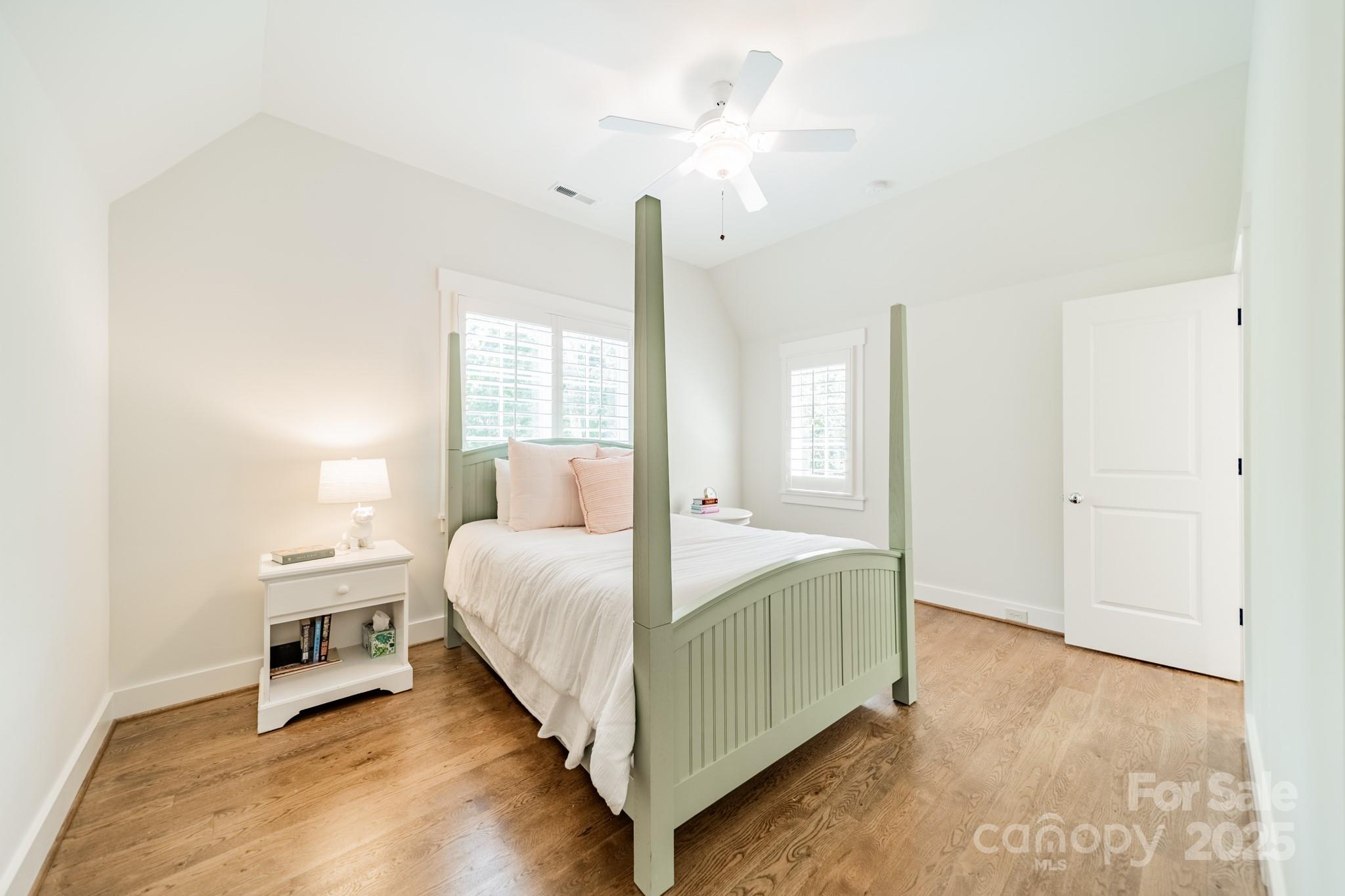 431 Bramble Way Fort Mill, SC 29708 - Photo 31 of 48 a bedroom with a bed and a chandelier
