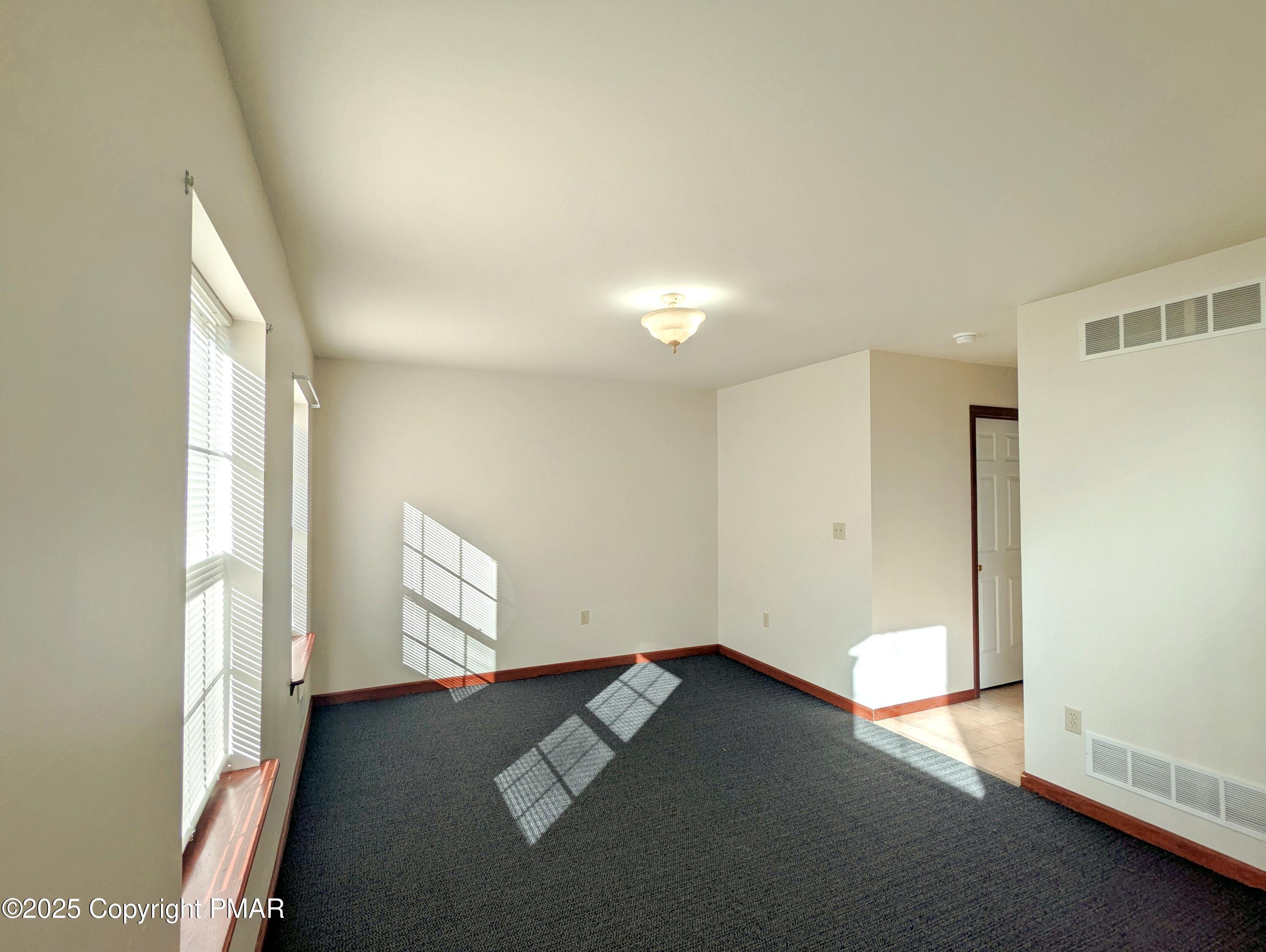 1603 Rachel Road Stroudsburg, PA 18360 - Photo 14 of 33 an empty room with windows