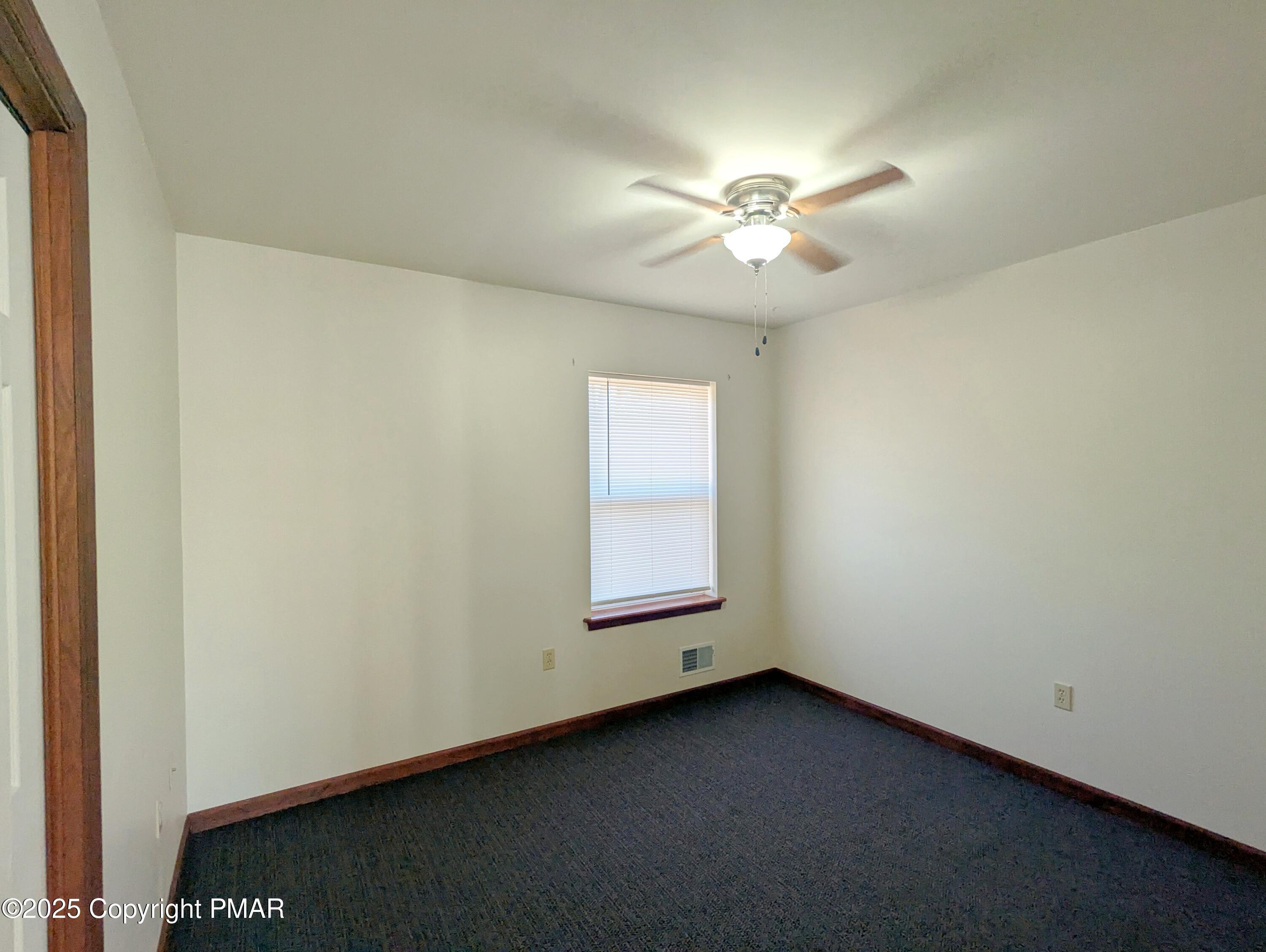 1603 Rachel Road Stroudsburg, PA 18360 - Photo 22 of 33 an empty room with a window and a ceiling fan