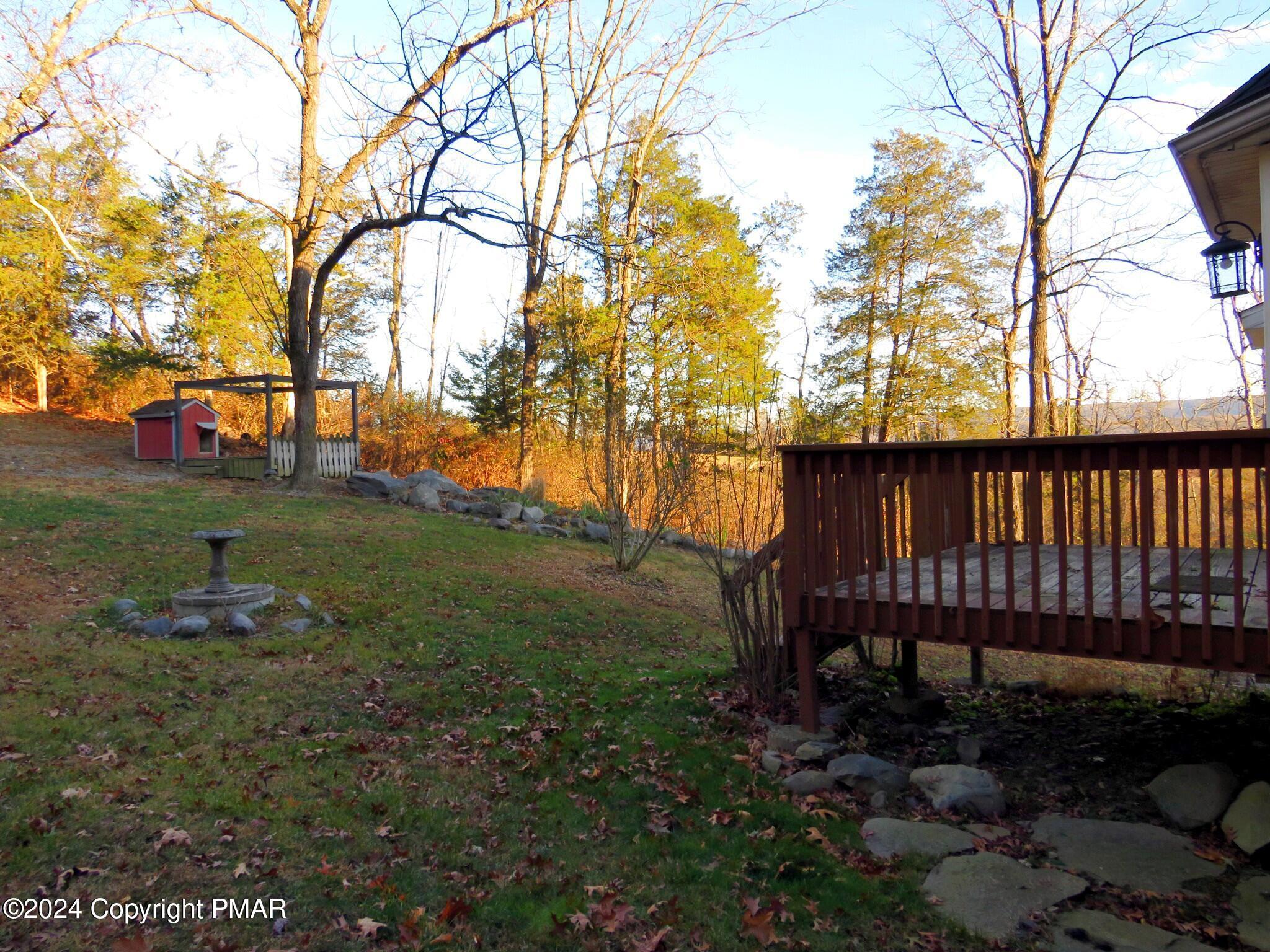 1603 Rachel Road Stroudsburg, PA 18360 - Photo 30 of 33 a backyard of a house with table and chairs