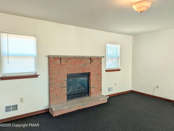 a living room with a fireplace