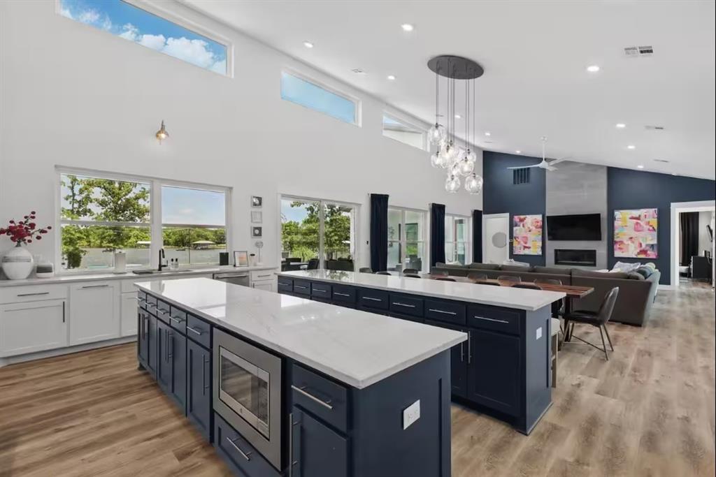 2752 Briarwood Harbor Road Malakoff, TX 75148 - Photo 13 of 37 a kitchen with a stove a counter top space a sink and cabinets