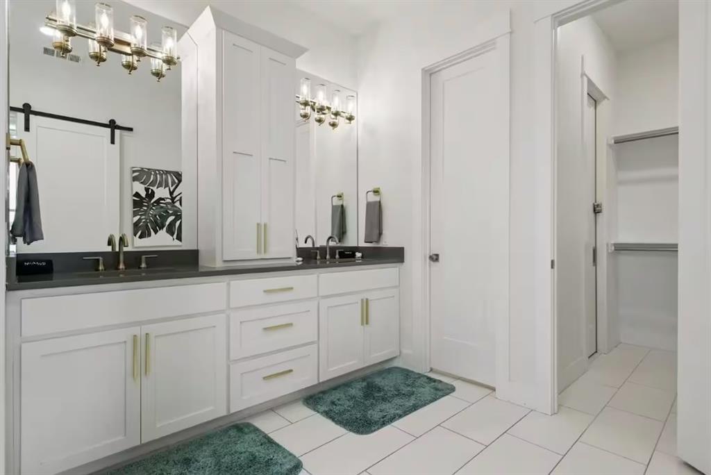 2752 Briarwood Harbor Road Malakoff, TX 75148 - Photo 20 of 37 a bathroom with a double vanity sink and a mirror
