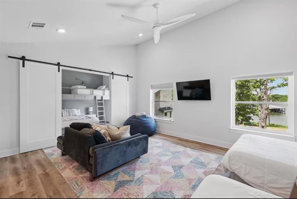 2752 Briarwood Harbor Road Malakoff, TX 75148 - Photo 29 of 37 a living room with furniture a flat screen tv and a large window