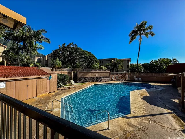 a view of a swimming pool and a patio