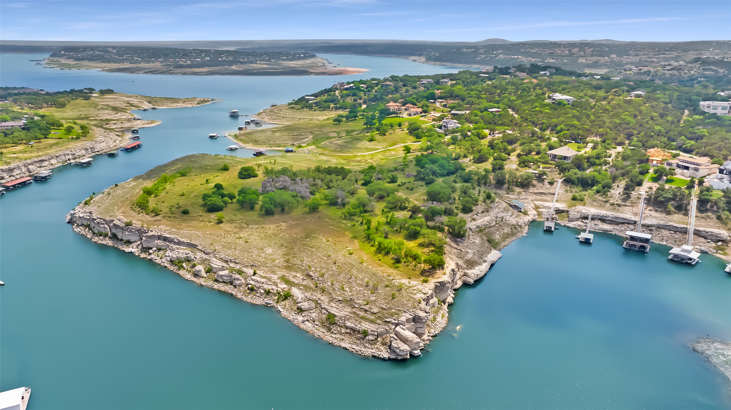 19813 Lakehurst Loop Spicewood, TX 78669 - Photo 22 of 22 a view of a lake with a mountain in the background