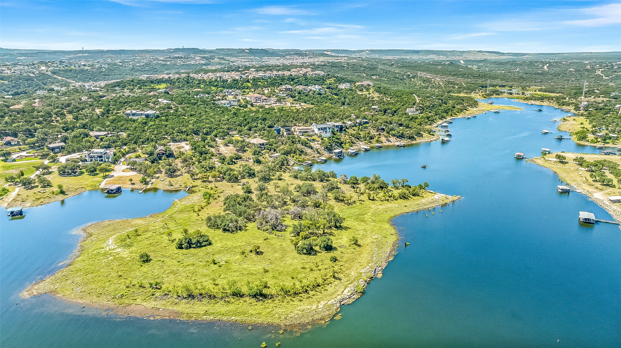 19813 Lakehurst Loop Spicewood, TX 78669 - Photo 3 of 22 an aerial view of residential houses with outdoor space and lake view