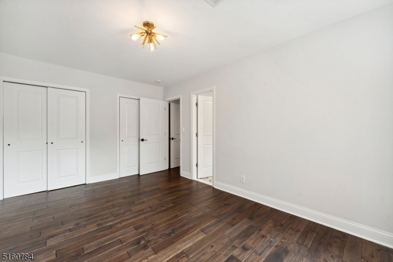 31 Upper Mountain Avenue, Unit 4 Montclair, NJ 07042 - Photo 12 of 22 a view of an empty room with a window and a ceiling fan