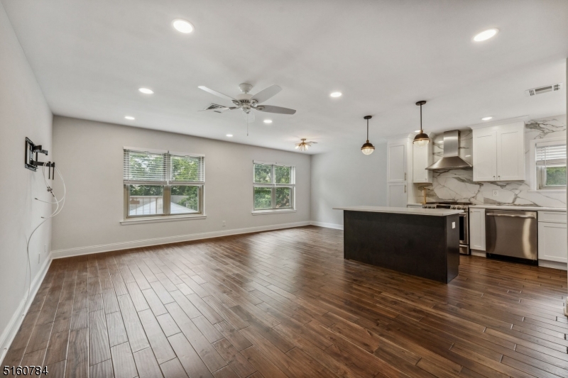 31 Upper Mountain Avenue, Unit 4 Montclair, NJ 07042 - Photo 4 of 22 a large kitchen with stainless steel appliances granite countertop a large window