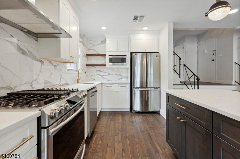 31 Upper Mountain Avenue, Unit 4 Montclair, NJ 07042 - Photo 6 of 22 a kitchen with wooden floors and appliances