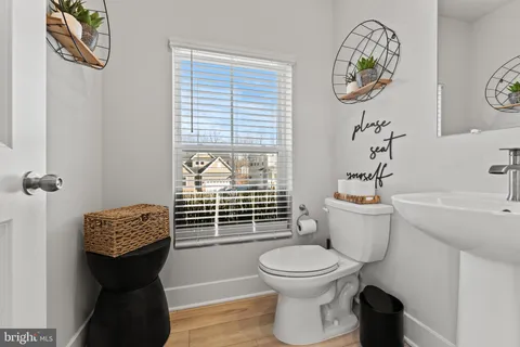 a bathroom with a toilet and a sink