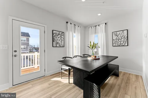 a view of a workspace with furniture and window