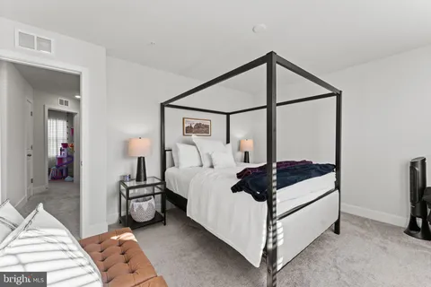 a bed room with a bed and a mirror
