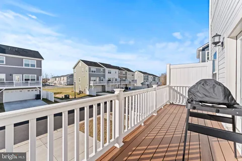 a view of a balcony with wooden floor