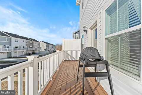 a view of a balcony with chairs