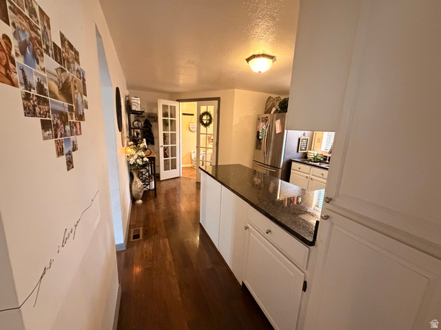 110 South 200 East Springville, UT 84663 - Photo 6 of 23 Hall featuring dark wood-style flooring and a textured ceiling